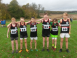 Athletes battle wind and rain in regional cross country event